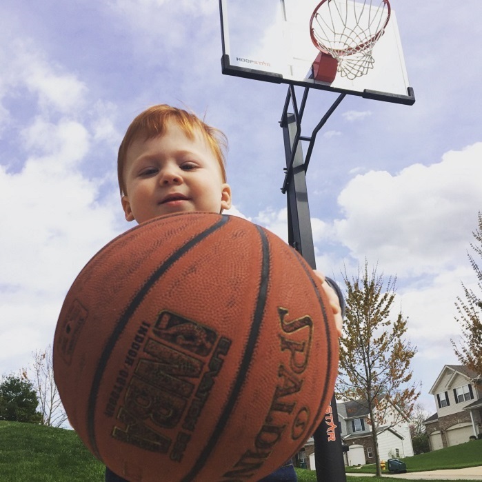 baby playing basketball